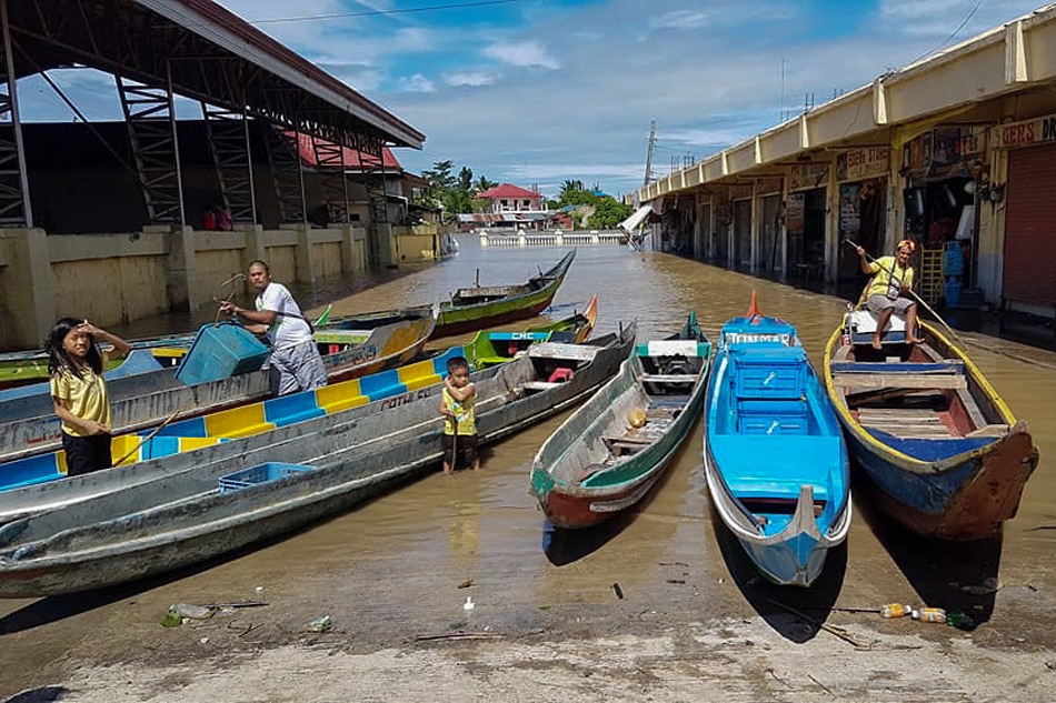 Boat operators berth on “loading stations” with Poblacion, Pontevedra, Capiz remain submerged after Tropical depression Agaton brought heavy rains in the area. Nonoy Basco, ABS-CBN News