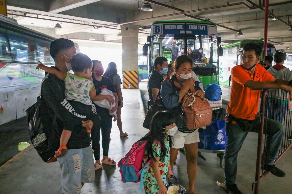 Passengers line up to take their designated bus trip going to various cities in Metro Manila and adjacent provinces at the Parañaque Integrated Terminal Exchange ( PITX ) in Parañaque City on April 11, 2022. Jonathan Cellona, ABS-CBN News/File