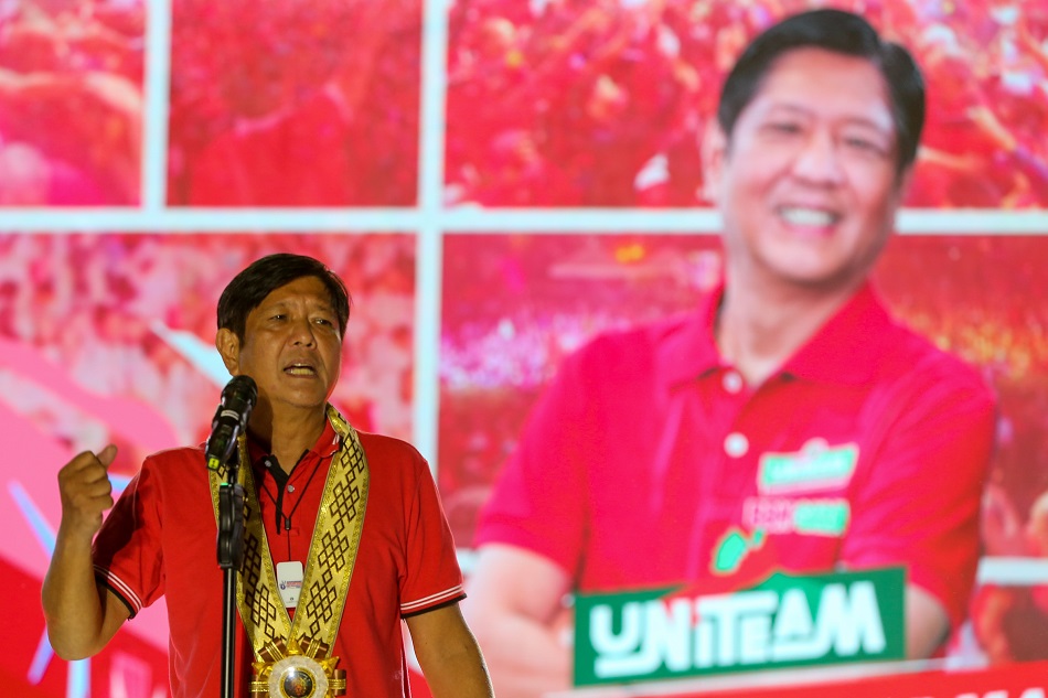 Presidential candidate Ferdinand Marcos Jr. greets supporters during a a grand rally at the Lima Commercial Estate along the border of Lipa and Malvar, Batangas on April 20, 2022. Jonathan Cellona, ABS-CBN News.