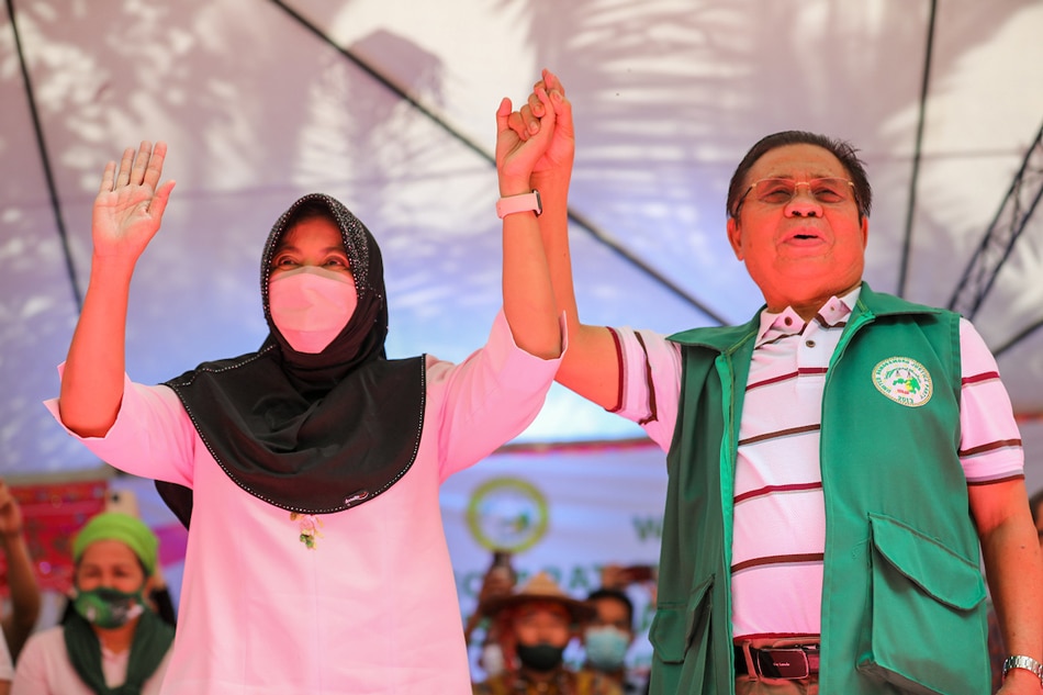 Moro Islamic Liberation Front (MILF) chairman and Bangsamoro Interim Chief Minister Al Haj Murad Ebrahim raises the hand of Vice President Leni Robredo, declaring her as the chosen presidential candidate of the MILF and its political party, the United Bangsamoro Justice Party (UBJP) on April 23, 2022 in Camp Darapanan, Sultan Kudarat town, Maguindanao. VP Leni Media Bureau handout 
