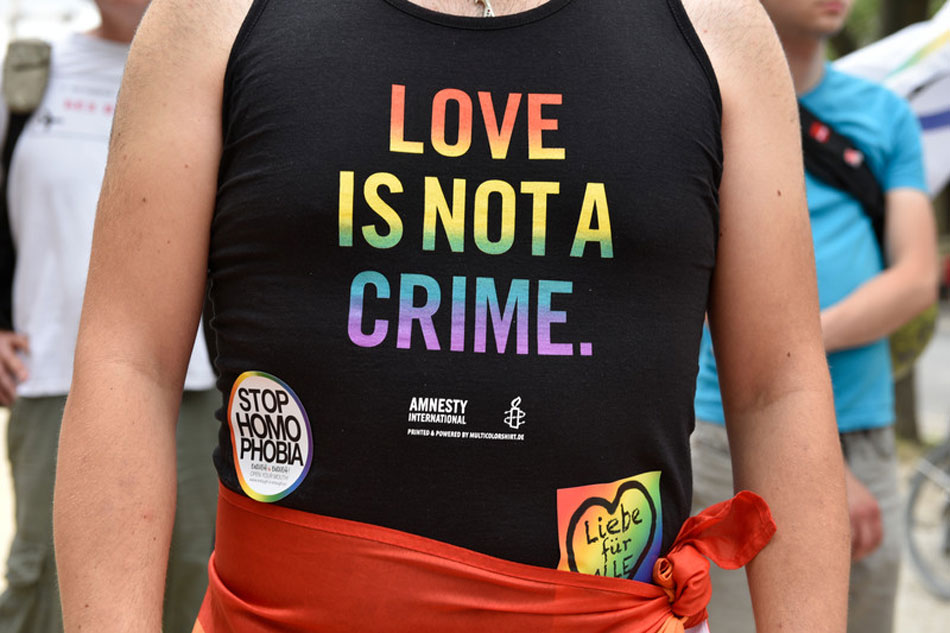 'Love is not a crime' is written on the short of an activist during an LGBT picket in front of the Russian embassy in Berlin, Germany, on June 10, 2018. Markus Heine, EPA-EFE/file