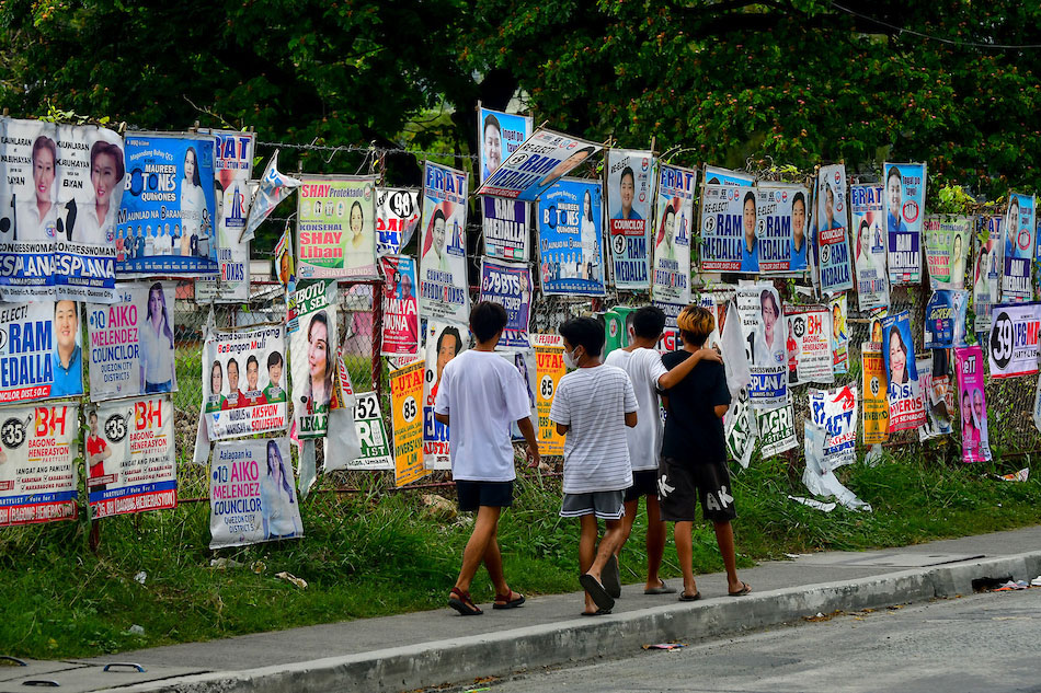 Campaign posters for the May 9 local and national elections adorn a fenced property in Quezon City on April 4, 2022. With a little over a month before the elections, candidates from all parties are wooing voters in traditional and non-traditional ways. Mark Demayo, ABS-CBN News