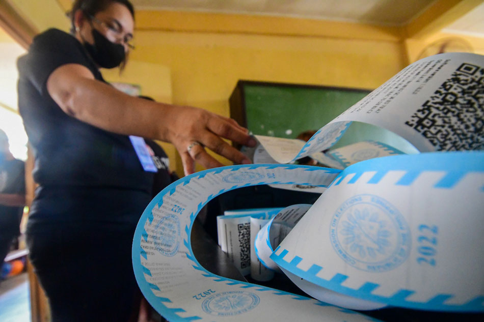 Members of the Electoral Board and poll watchers conduct their final testing and sealing of vote counting machines at Melencio M. Castelo Elementary School in Quezon City on Tuesday, with 5 days before the national elections. Mark Demayo, ABS-CBN News