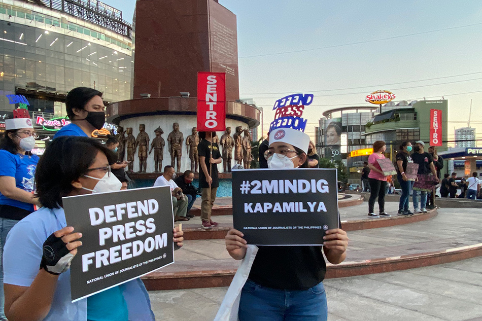Members of various media groups remember the shutdown of ABS-CBN two years ago, at a rally on Timog Avenue on May 5, 2022. Fernando Sepe Jr., ABS-CBN News