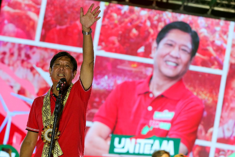 Presidential candidate Ferdinand Marcos Jr. greets supporters during a grand rally at the Lima Commercial Estate along the border of Lipa and Malvar Batangas on April 20, 2022. Jonathan Cellona, ABS-CBN News.