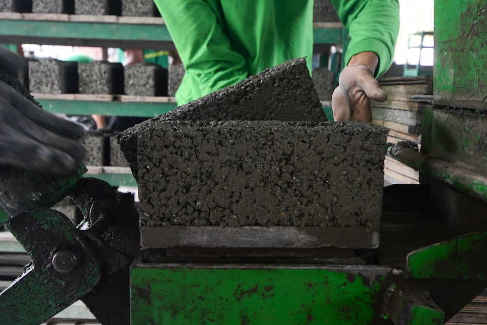 Workers produce bricks mixed with upcycled plastics at Green Antz' site in Plaridel, Bulacan. Mark Demayo, ABS-CBN News