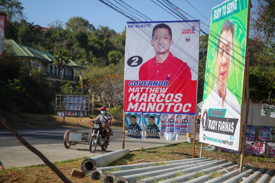 Campaign materials of Ilocos Norte gubernatorial candidates Rudy Fariñas and Matthew Marcos Manotoc by the highway passing Batac, Ilocos Norte, May 06, 2022. Jonathan Cellona, ABS-CBN News.