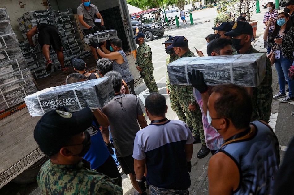 Police officers secure the area during the delivery of official ballots at the Manila City Hall on May 5, 2022. Jonathan Cellona, ABS-CBN News