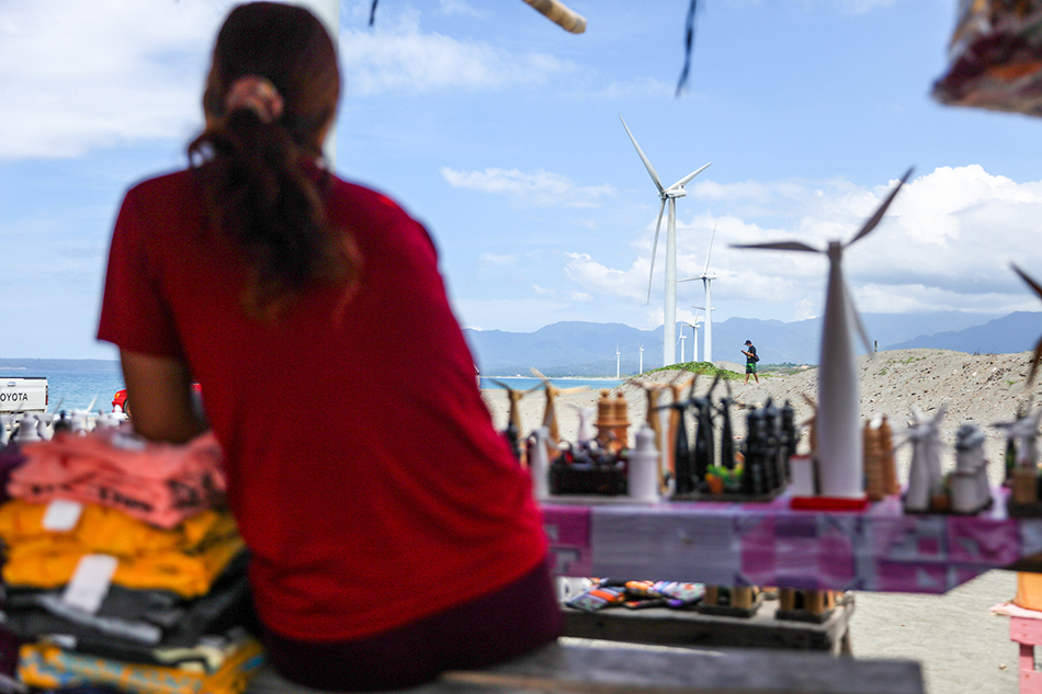 Vendors sell trinkets to tourists at the Bangui Windmills in Ilocos Norte on May 7, 2022. Jonathan Cellona, ABS-CBN News.