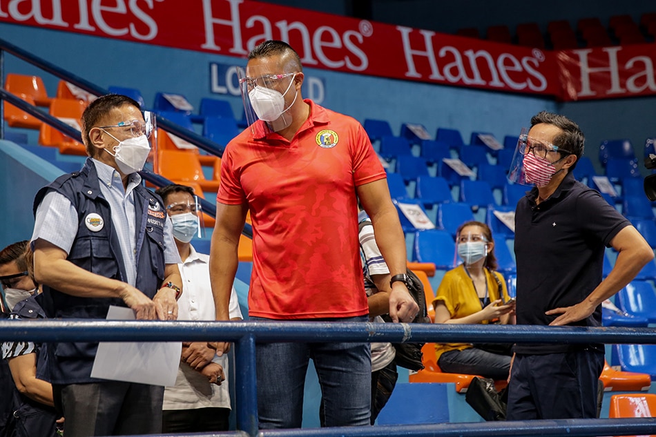 San Juan City Mayor Francis Zamora (middle) welcomes Health Department Secretary Francsisco Duque III and National Task Force against COVID19 Deputy Chief Implementer Vince Dizon during the COVID19 vaccine inoculation at the San Juan Arena on March 30, 2021. George Calvelo, ABS-CBN News/file