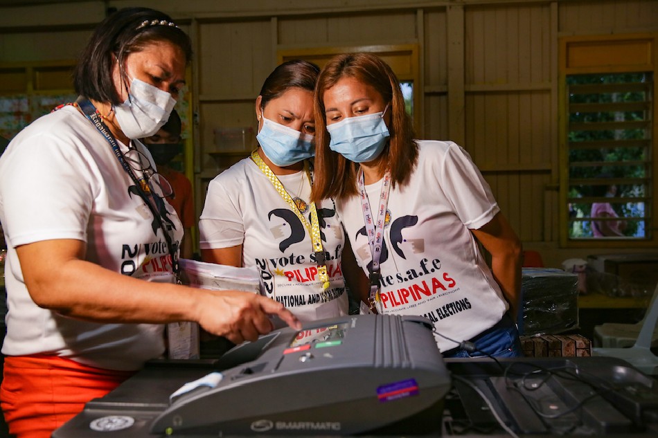 Poll workers prepare election equipment at the Kiamba Central Elementary School in Sarangani province on May 9, 2022. George Calvelo, ABS-CBN News