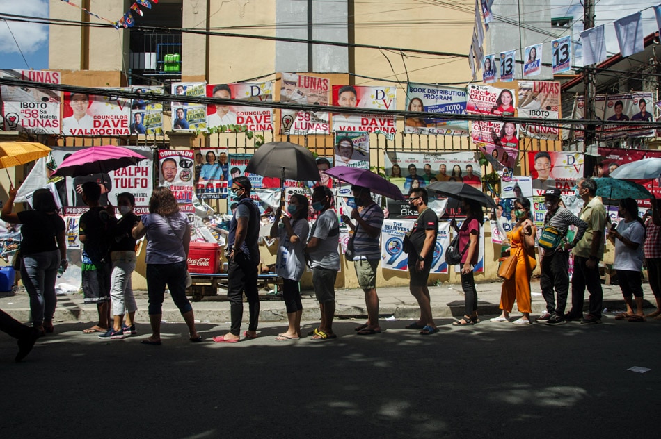 Voters queue at the Batasan National High School on May 9, 2022. Larry Monserate Piojo, ABS-CBN News