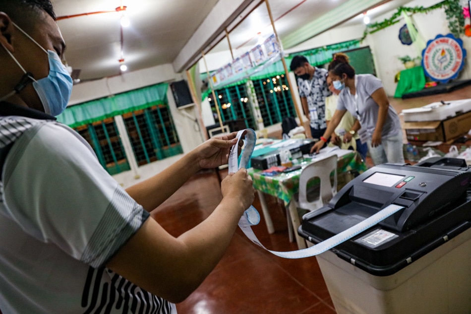 Members of the electoral board process the precinct's ballots as voting ends at the Mariano Marcos Memorial Elementary School in Batac, Ilocos Norte on May 9, 2022. Jonathan Cellona, ABS-CBN News/File