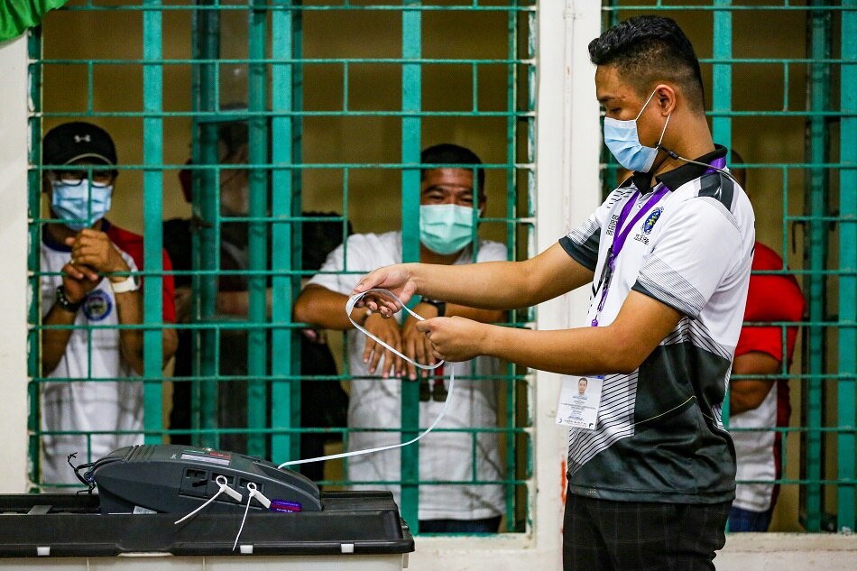 Members of the Electoral Board process the precinct's ballots as voting ends at the Mariano Marcos Memorial Elementary School in Batac, Ilocos Norte on May 9, 2022. Jonathan Cellona, ABS-CBN News/file