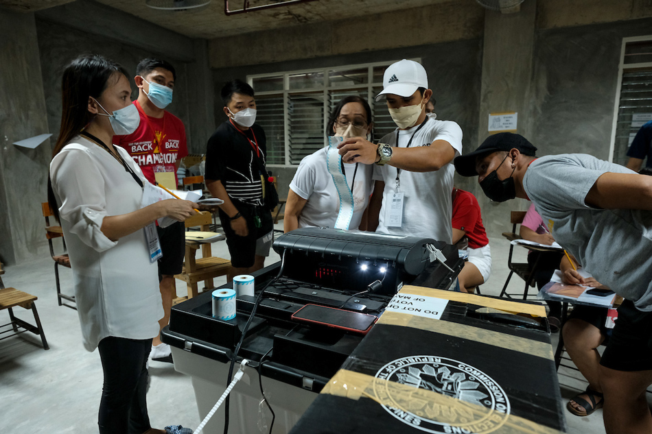 Electoral board members generate the number of votes from their precinct at the Sta. Lucia Elementary School in San Juan City at the end of voting during the national and local elections on May 9, 2022. Fernando G. Sepe Jr., ABS-CBN News