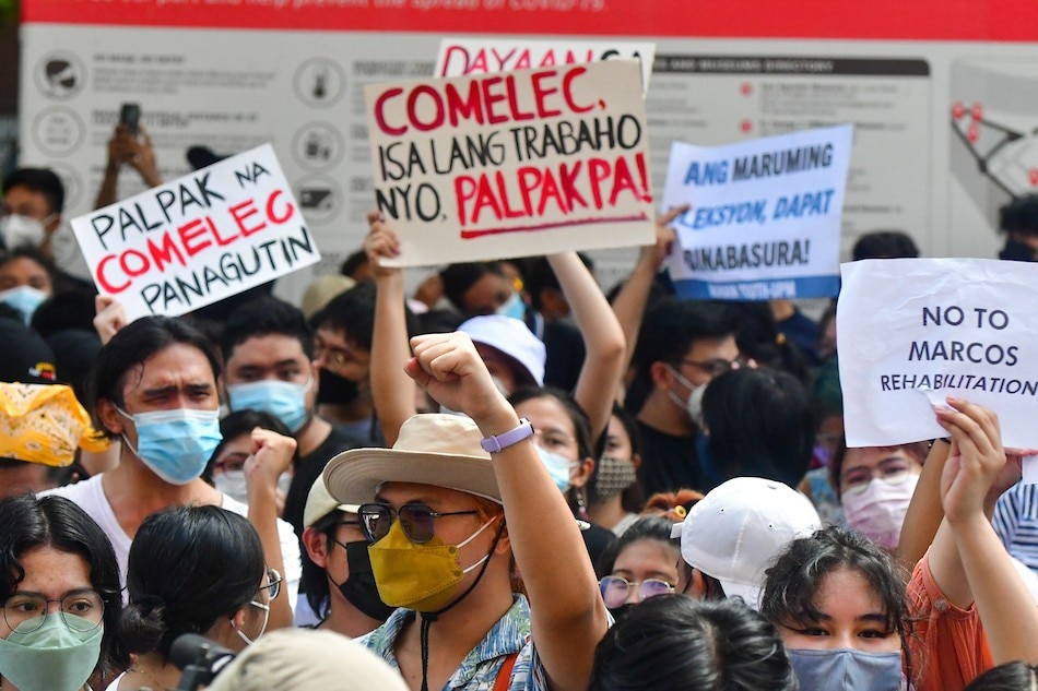 Protesters from various sectors picket in front of the Comelec office in Manila on May 10, 2022, a day after Election Day. Partial, unofficial counts show Bongbong Marcos Jr. and Sara Duterte leading the presidential and vice presidential race, respectively. Mark Demayo, ABS-CBN News