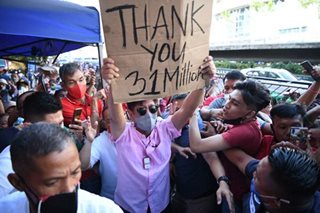 Marcos camp assumes victory, forms transition team