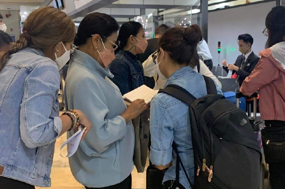 Vice President Leni Robredo falls in line at the Korean Airline check-in counter on May 14, 2022 for her US flight to attend the graduation of daughter Jillian at the New York University.