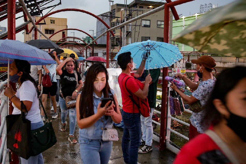 A pedestrian purchases an umbrella  ABS-CBN News/file