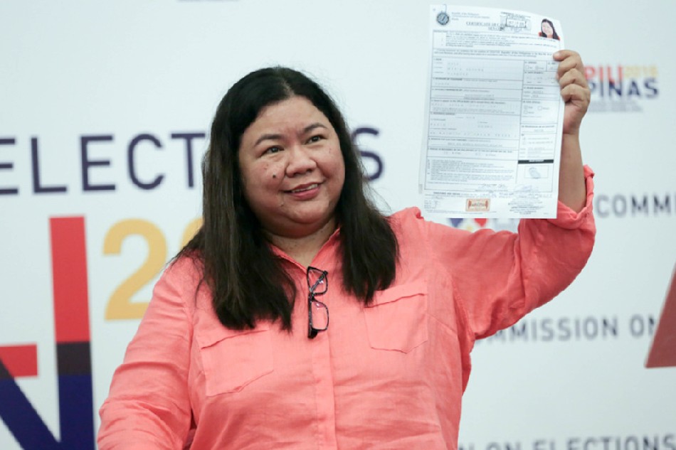 OFW representative Susan Toots Ople shows her certificate of candidacy at the Commission on Election on Oct. 15, 2015. Jonathan Cellona, ABS-CBN News/File 