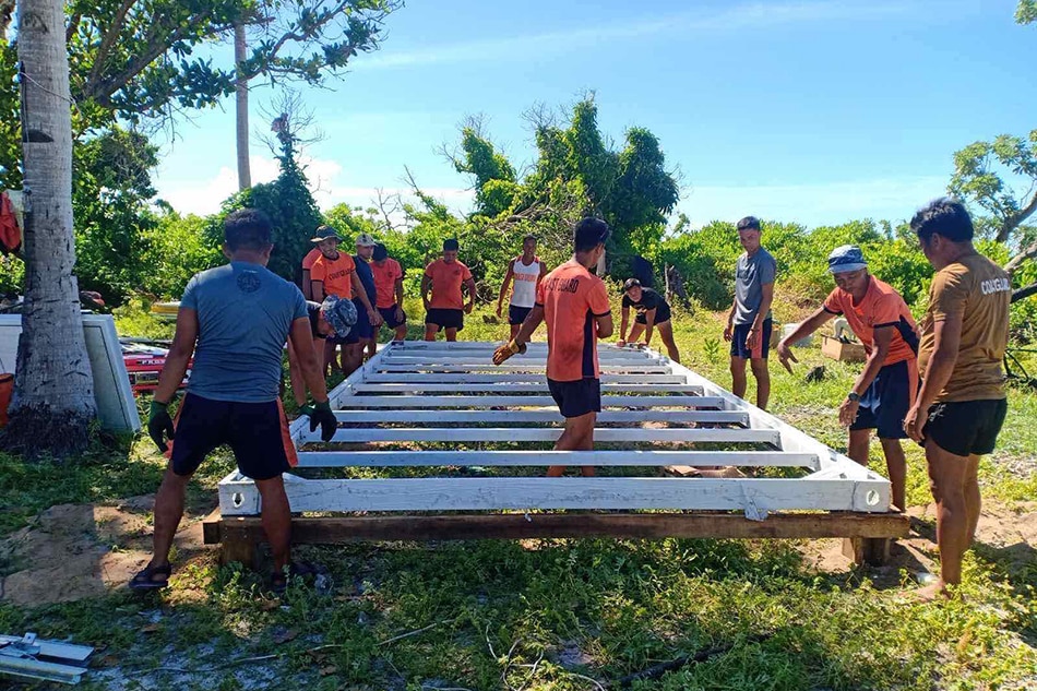 Philippine Coast Guard personnel build an outpost in the West Philippine Sea. PCG handout