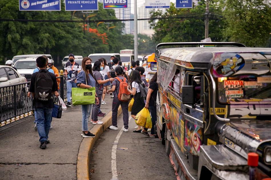 Commuters wait for jeepneys at a loading bay in Manila on May 17, 2022. George Calvelo, ABS-CBN News/file