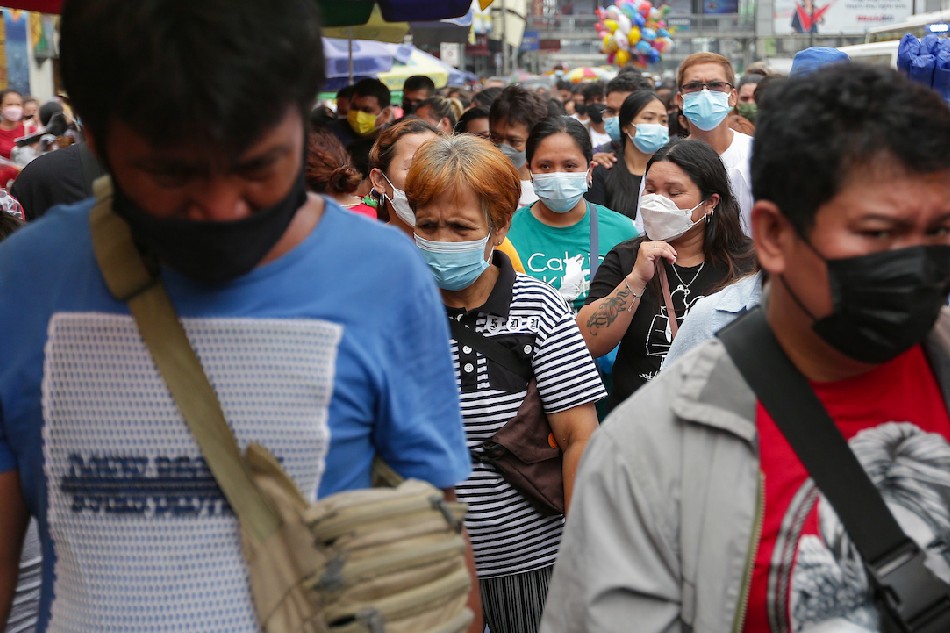 People exit the Quiapo Church after hearing the Friday Mass on March 11, 2022. George Calvelo, ABS-CBN News]