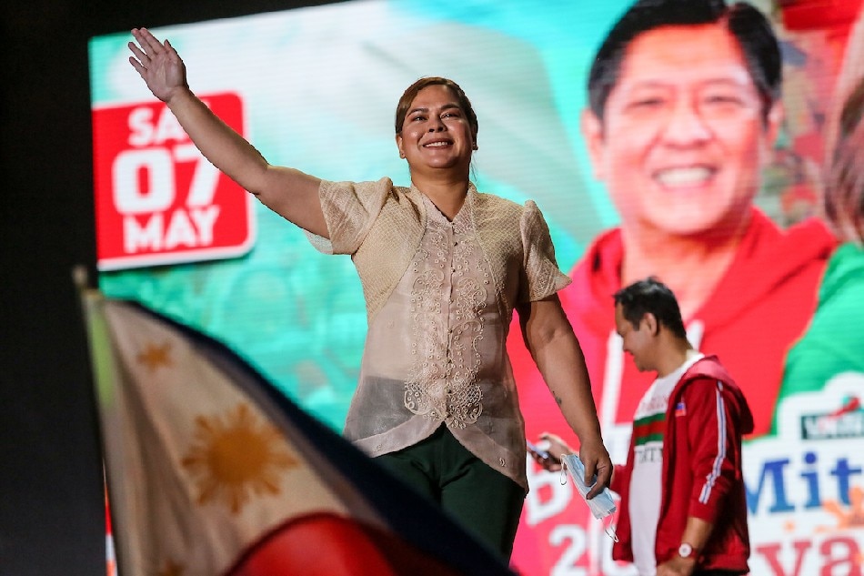 Vice presidential candidate Sara Duterte-Carpio is welcomed on stage during the UniTeam's Miting De Avance on Aseana Avenue in Parañaque on May 7, 2022. Fernando G. Sepe Jr., ABS-CBN News