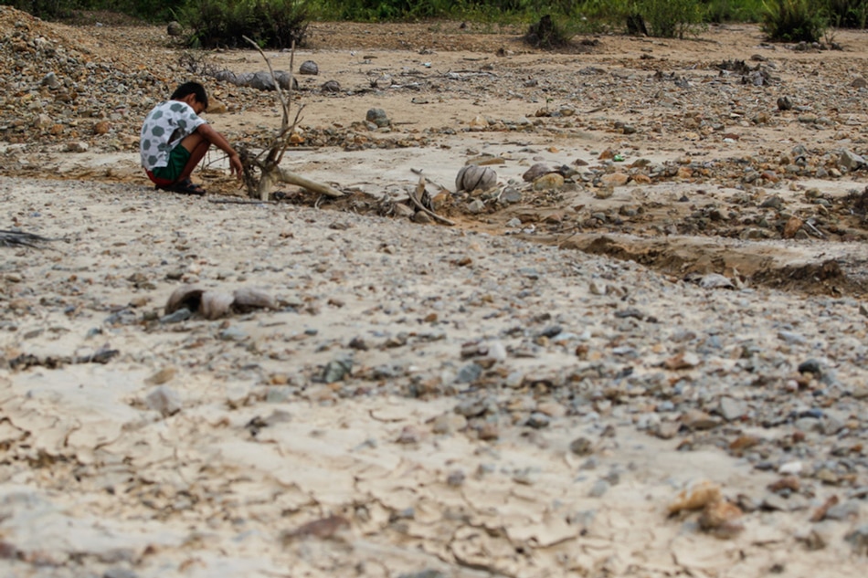 A boy plays on a dry riverbed in Mogpog, Marinduque, 20 years after the Marcopper mining disaster on March 22, 2016. Several river systems in the province were left heavily silted and severely poisoned when the Marcopper mine tailings dam leaked mercury-contaminated discharge, impacting the province’s water and food supply. Jonathan Cellona, ABS-CBN News/File 