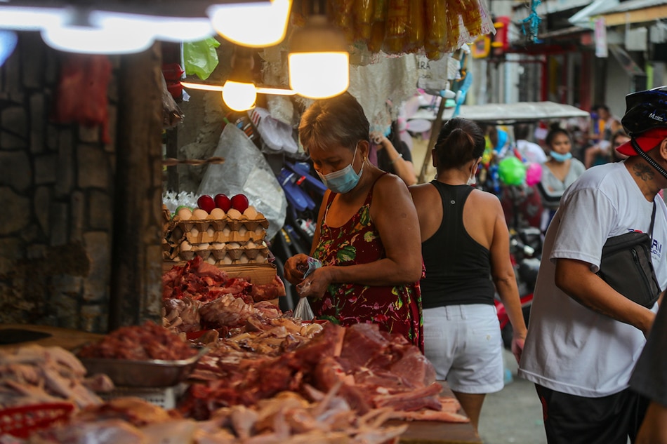 Residents buy basic goods at a wet market in Tatalon, Quezon City on April 8, 2022, Jonathan Cellona, ABS-CBN News/file