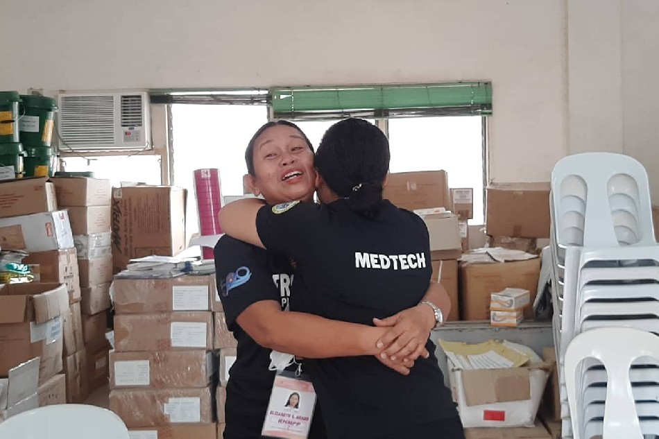 Elizabeth Arado and April Arong Parusal share an embrace as they reunite in Lapu-Lapu City. Before dying in 2012 at the age of 82, Elizabeth's father, Percival, confessed to Elizabeth that he had another family and requested Elizabeth to look for her other siblings. Courtesy: Lapu-Lapu City PIO 