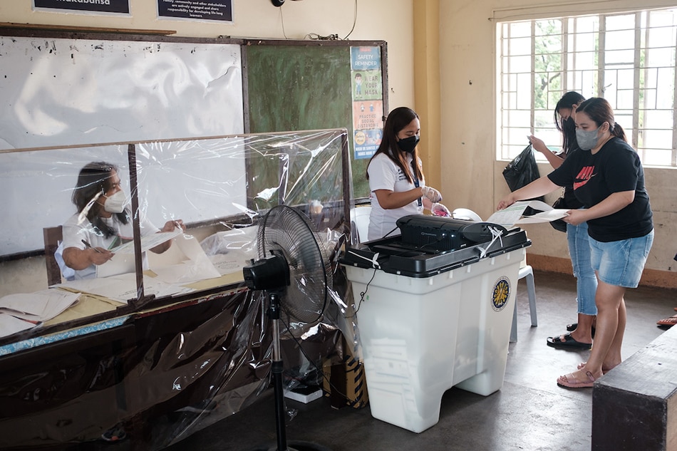 Residents of Barangay Vasra, Project 6, Quezon City cast their votes at the Mines Elementary School on May 9, 2022. Alec Corpuz, ABS-CBN News/File
