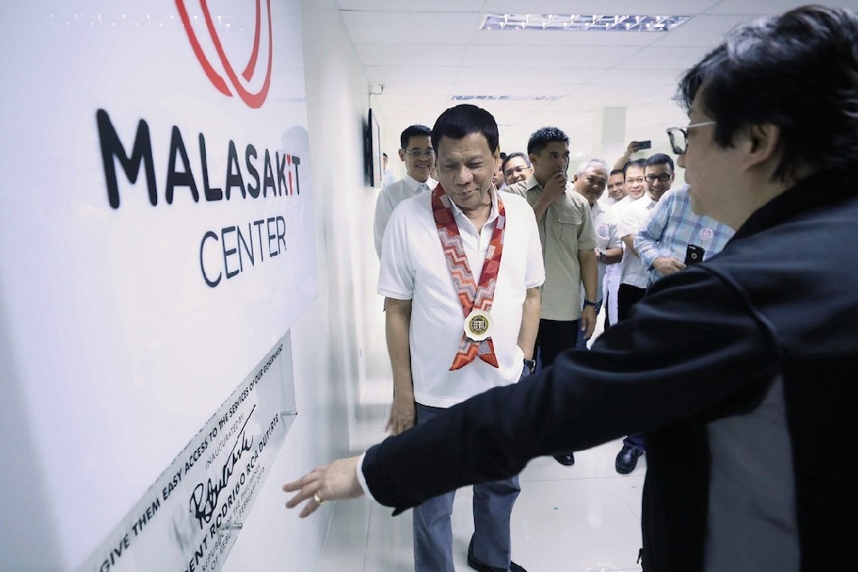 President Rodrigo Duterte is accompanied by Presidential Assistant for Visayas Michael Dino following the unveiling of the dedication plate of the Malasakit Center during the launching of the Malasakit Program at the Vicente Sotto Memorial Medical Center in Cebu City on February 12, 2018. Ace Morandante, Malacanang Photo