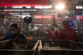 China factory activity shrinks at slower pace in May