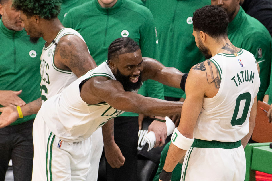 Boston Celtics guard Jaylen Brown (L) pushes forward Jayson Tatum (R) after the two of them left the game during the second half of Game 7 against the Milwaukee Bucks at the TD Garden in Boston, Massachusetts, USA, 15 May 2022. CJ Gunther, EPA-EFE.