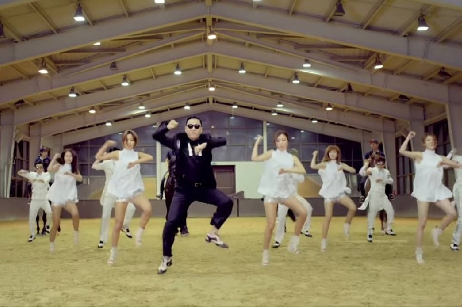 A scene from the music video of Psy's 2012 hit 'Gangnam Style,' showing the South Korean rapper moving to the iconic horse-riding dance accompanying the song. Screengrab from YouTube video