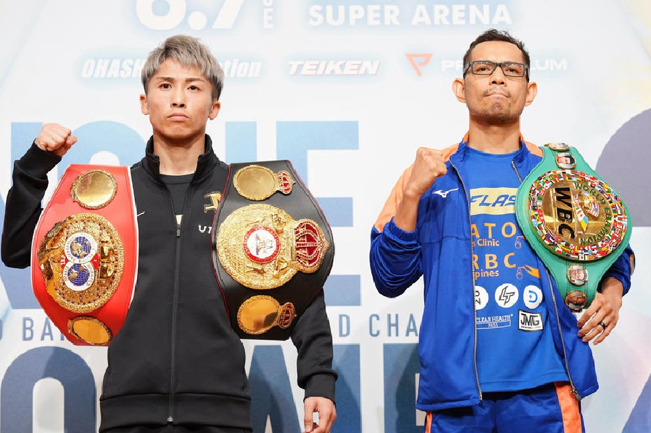 WBA and IBF bantamweight champion Naoya Inoue of Japan (L) poses with WBC bantamweight champion Nonito Donaire of the Philippines during a press event in Yokohama, near Tokyo, Japan, on June 3, 2022. EPA-EFE/Japan pool/file