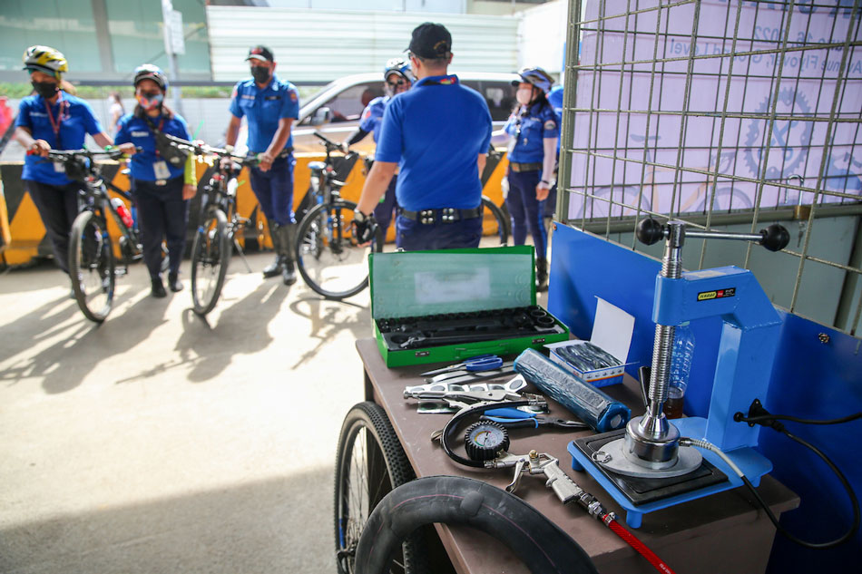 MMDA Bike Lane Program Officers (BLPO) park their bikes during the inauguration of the Metro Manila Development Authority (MMDA) motorcycle and bike repair station along EDSA in Quezon City on June 16, 2022. Jonathan Cellona, ABS-CBN News