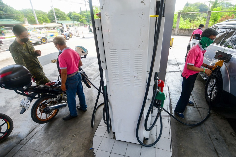 Members of the military and their dependents queue for fuel at an exclusive gas station in Taguig City on June 6, 2022, a day before another round of oil price hikes. Mark Demayo, ABS-CBN News