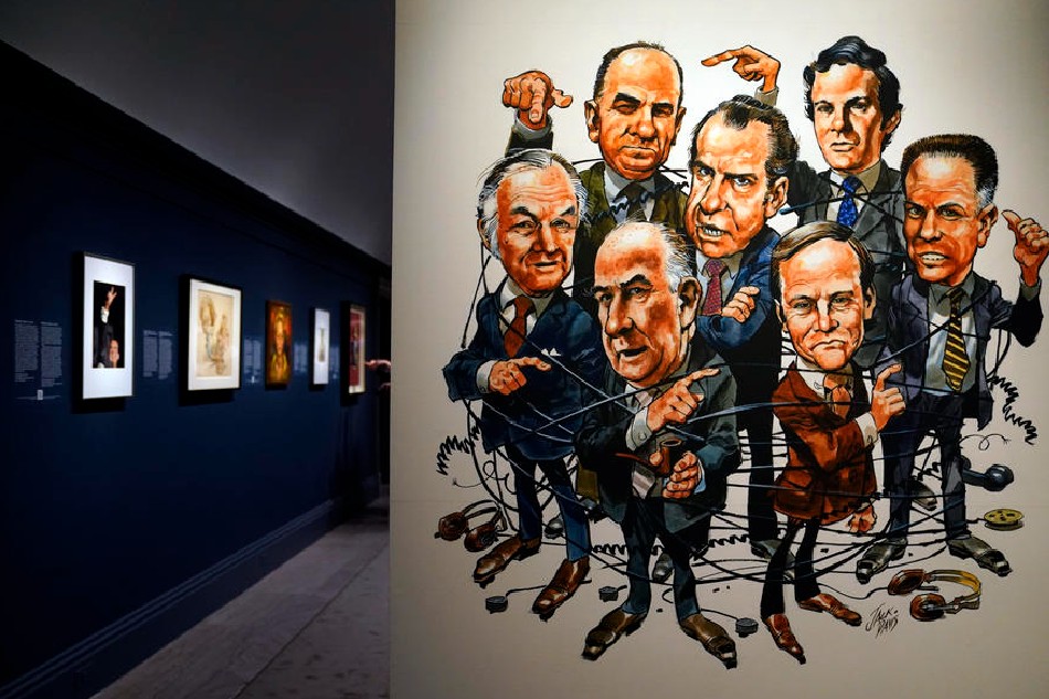 A caricature that appeared on the cover of Time magazine in April 1973 is on display at the 