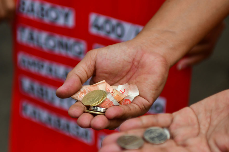 Members of Kilusang Mayo Uno call for raising the minimum wage amid rising prices of market goods in Quezon City on January 21, 2021. Mark Demayo, ABS-CBN News/file