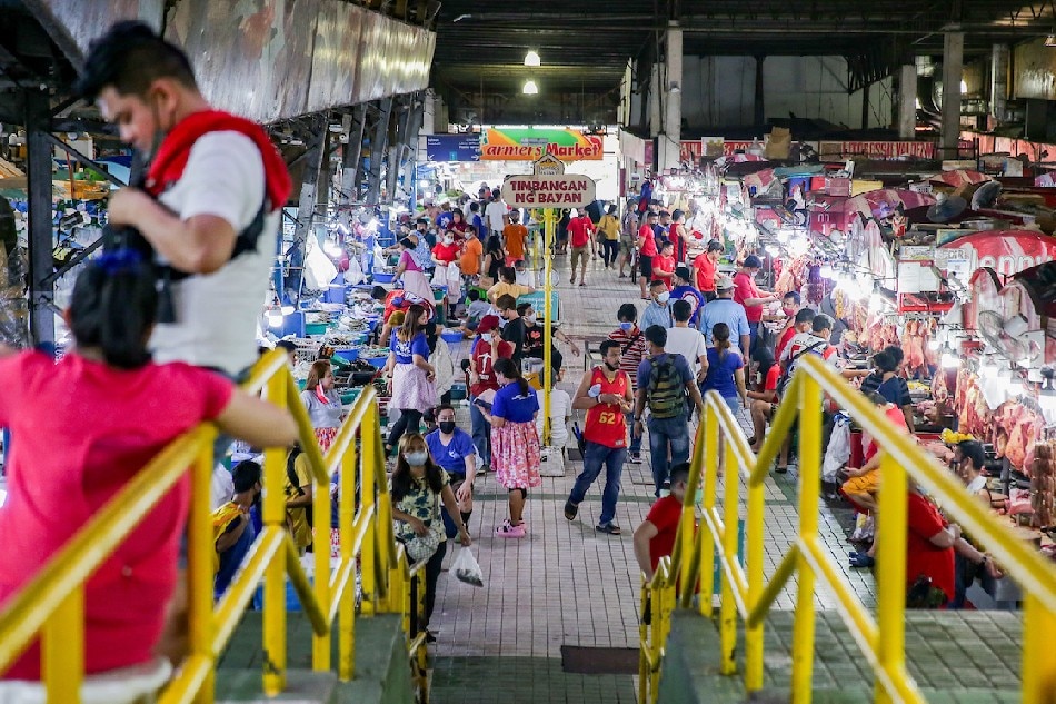 People visit the Farmers Market in Cubao, Quezon City on February 19, 2022 days after Fitch Ratings affirmed the Philippines' investment-grade BBB rating, a notch above minimum investment grade which provides the country access to more credit with lower interests. George Calvelo, ABS-CBN News