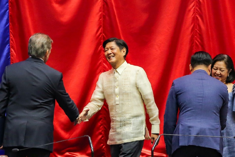 Ferdinand Marcos Jr. is proclaimed the president-elect of the Philippines during a formal ceremony officiated by Senate President Vicente Sotto III (L) and House Speaker Lord Allan Velasco at the House of Representatives at the Batasan Pambansa in Quezon City on May 25, 2022
