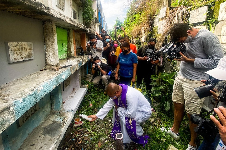 Fr. Flaviano “Flavie” Villanueva, a missionary from the Society of the Divine Word (SVD), joins members of the families of drug war killings as they receive the exhumed remains of their loved ones from the Tala Cemetery in Caloocan City on June 10, 2022. Jonathan Cellona, ABS-CBN News