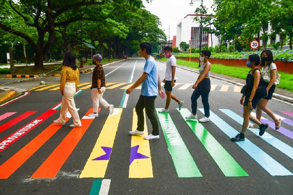 Members of the LGBTQI community and allies open a rainbow crosswalk along the Academic Oval in UP Diliman near the West Wing of Palma Hall on Monday, in line with Pride month celebrations. Mark Demayo, ABS-CBN News/File