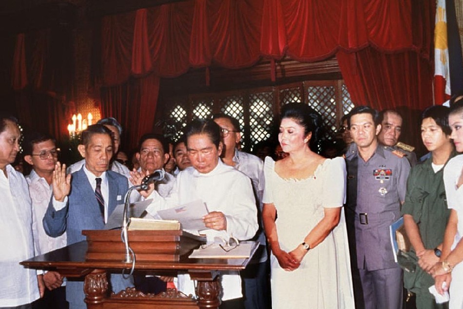 President Ferdinand E. Marcos is sworn by Chief Justice Ramon Aquino in the Ceremonial Hall of Malacañan Palace. The inauguration took place on February 25, 1986. Photo by AFP