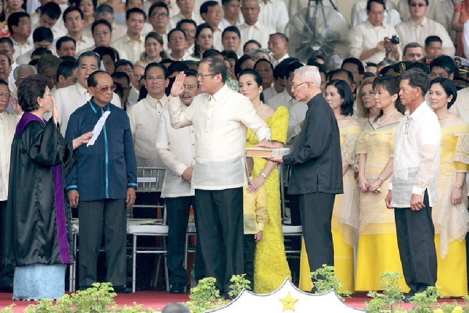 Benigno 'Noynoy' Aquino III (2L) takes his oath as the Philippines' 15th president on the Quirino grandstand, Manila, Philippines on 30 June 2010 before hundreds of thousands of cheering supporters. Photo by Val Handumon, EPA