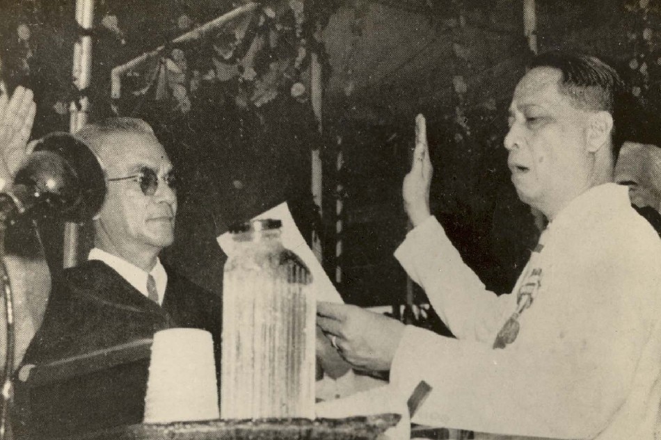 FILE. President Roxas takes his oath of office during the Independence Ceremony of July 4, 1946. Administering the oath is Chief Justice Manuel Moran. Photo from Official Gazette