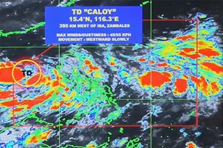 Tropical depression Caloy moves slowly over West PH Sea