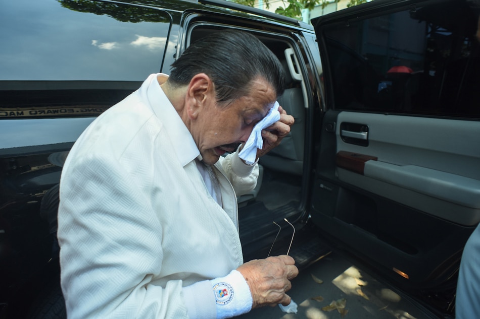  Former president Joseph Estrada wipes sweat off his face in Sta. Mesa on May 13, 2019. George Calvelo, ABS-CBN News/File